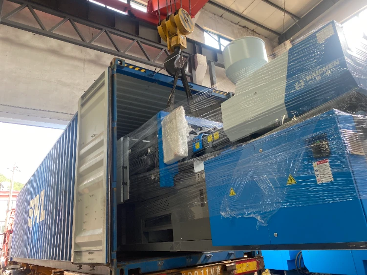 loading injection molding machine to container